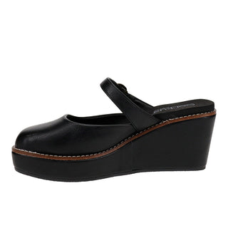 A black leather wedge mule sandal with a platform sole and a single strap across the top, shown from a side profile on a white background.