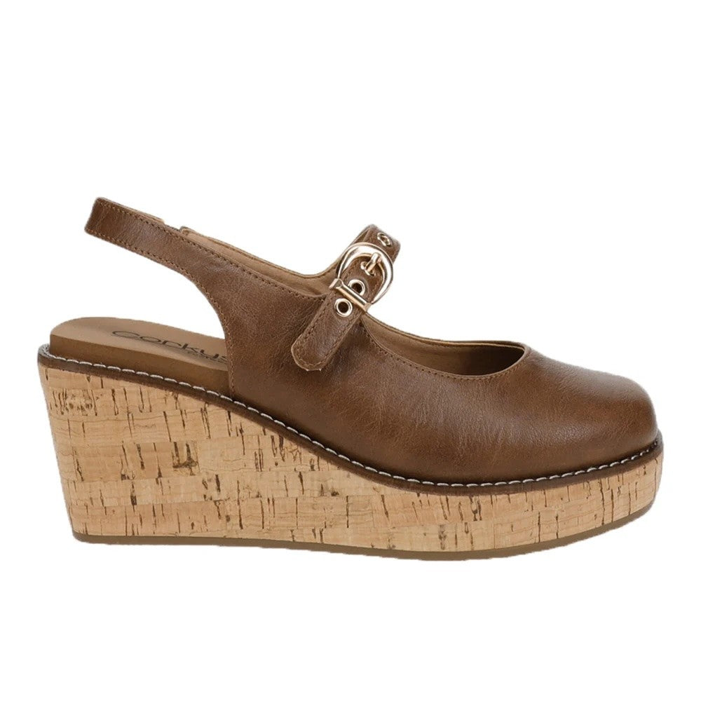 A single brown leather wedge sandal with a buckle strap across the top and a thick cork-textured platform wedge heel, shown against a plain white background.