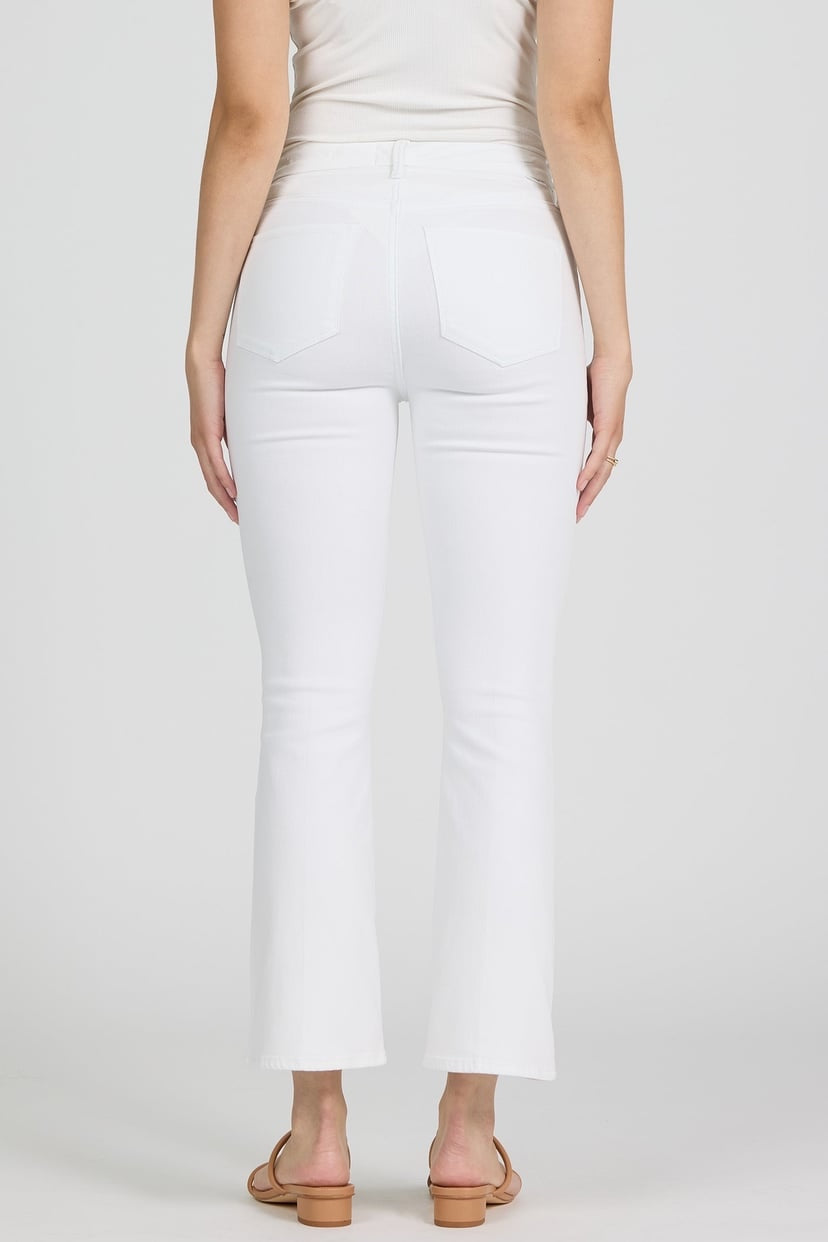 White pants worn by a person on a white background