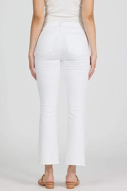 White pants worn by a person on a white background