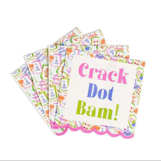 A stack of square paper napkins with scalloped edges, featuring a colorful pattern of playing cards and the text 'Crack Dot Bam!' in pink, blue, and green lettering on a white napkin.