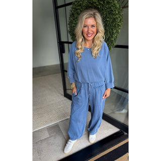 blond girl in blue 2 piece set
