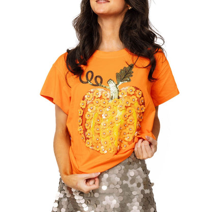 girl wearing orange t shirt with pumpkin