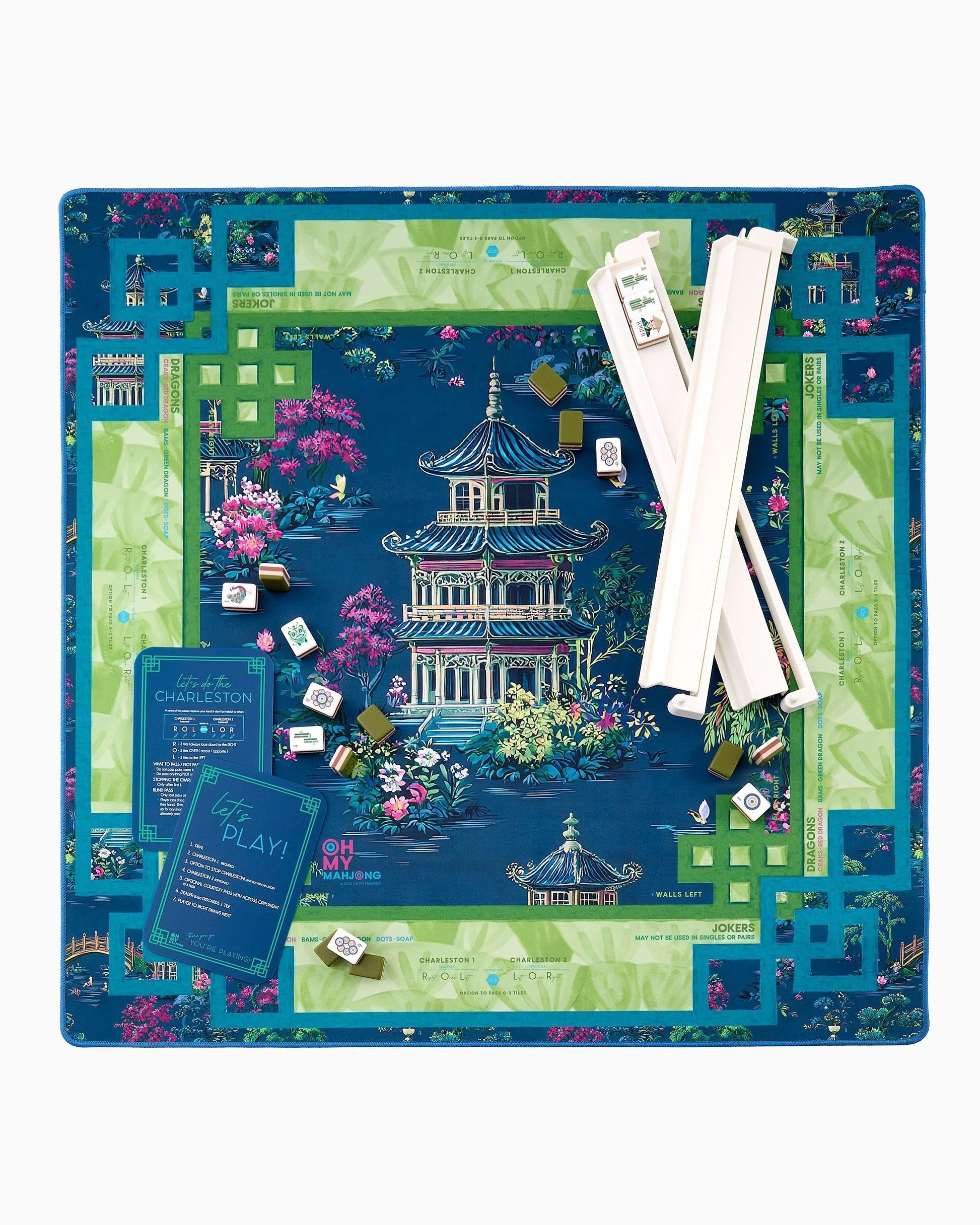 Board game set with colorful board, pieces, and cards on a white background