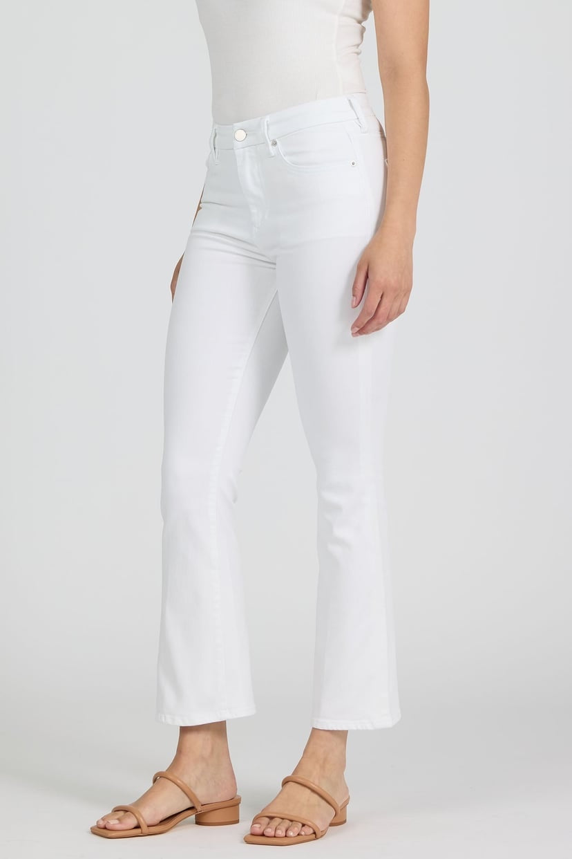 White jeans worn by a person on a white background