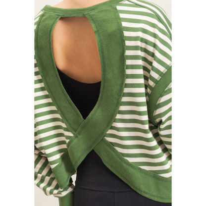 Green and white striped top with open back on a plain background