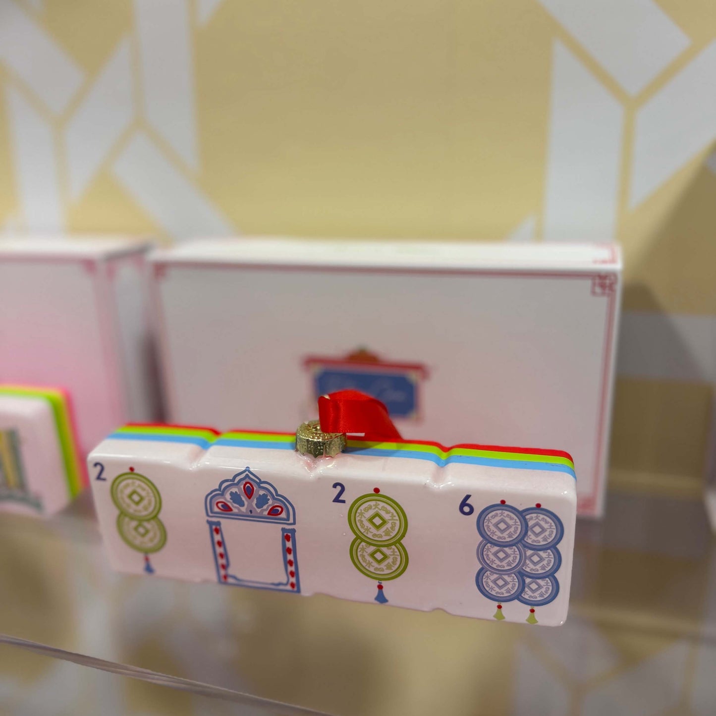 Colorful toy with numbers and patterns on a reflective surface
